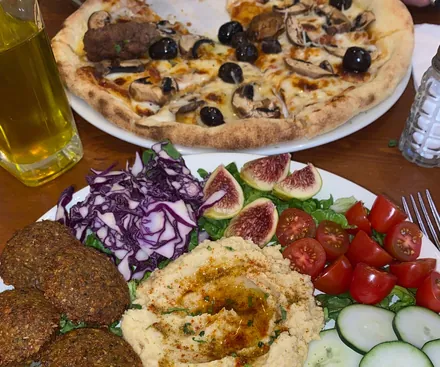 Vegetable pizza and mezze plate at Culture Box Fès