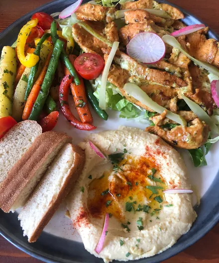 Hummus platter with grilled vegetables and flatbread