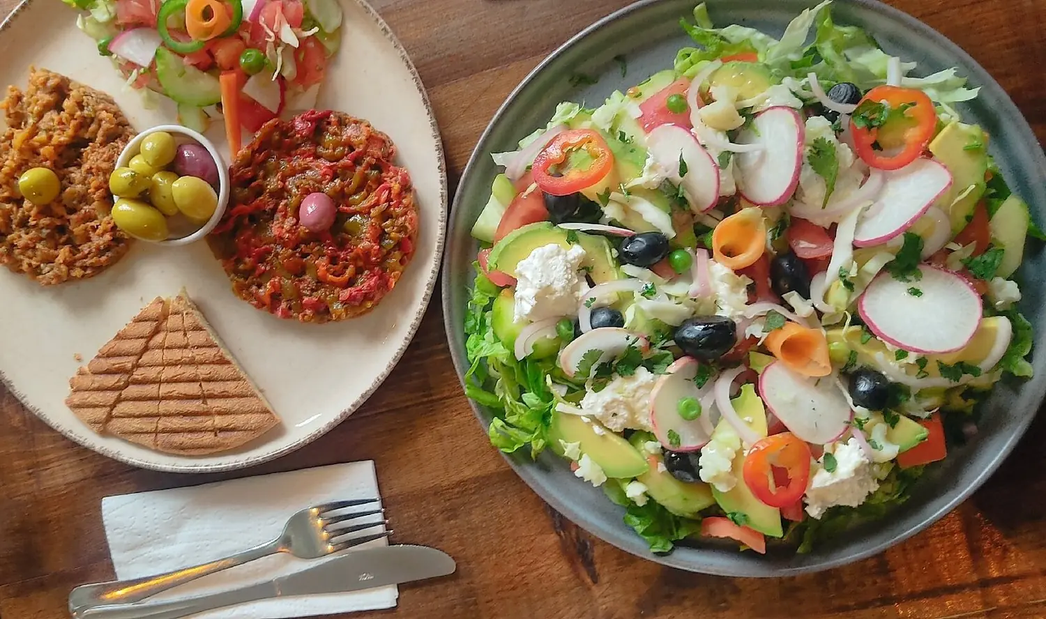 Moroccan salads and mezze on a wooden table at Culture Box